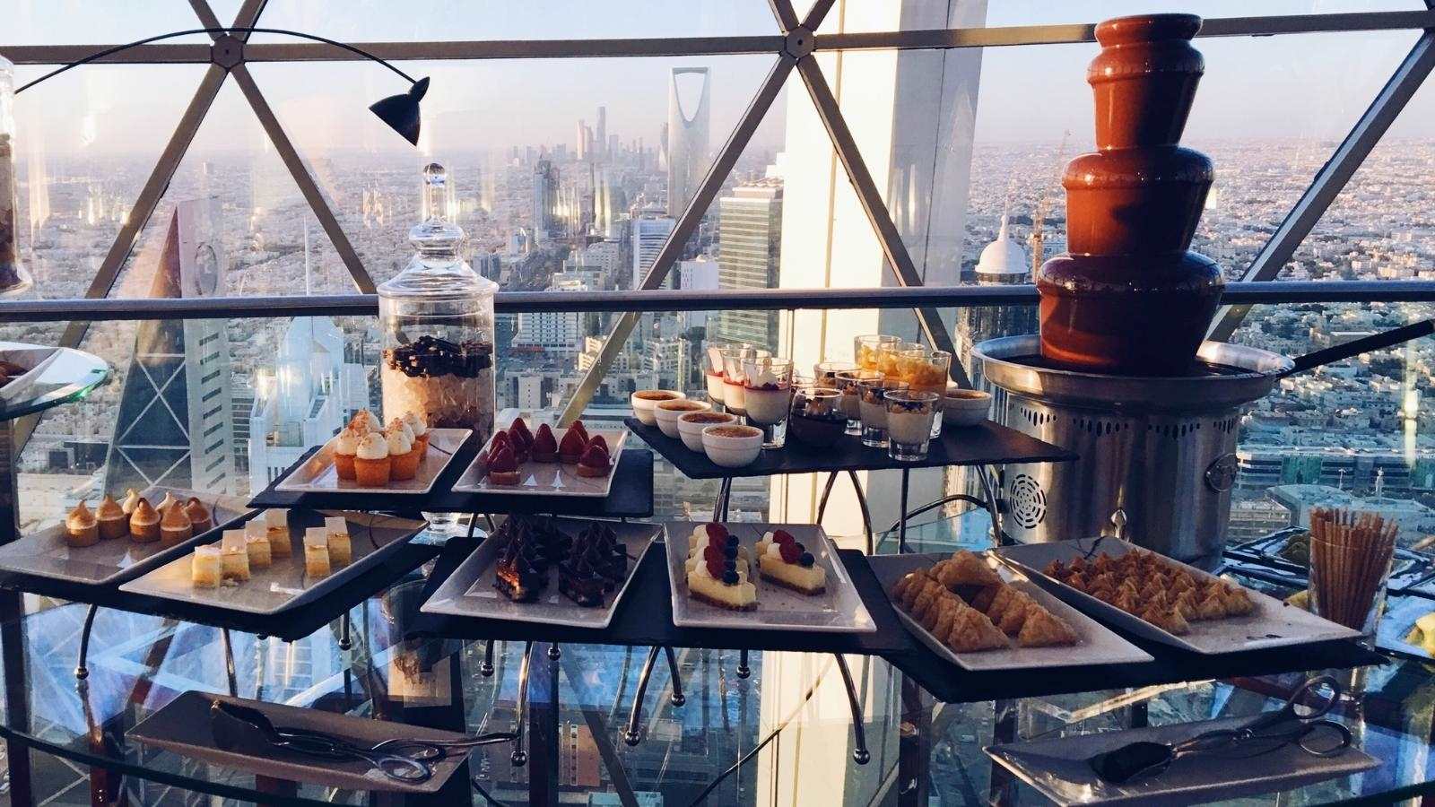 afternoon high tea dessert canape buffet overlooking riyadh city, saudi arabia