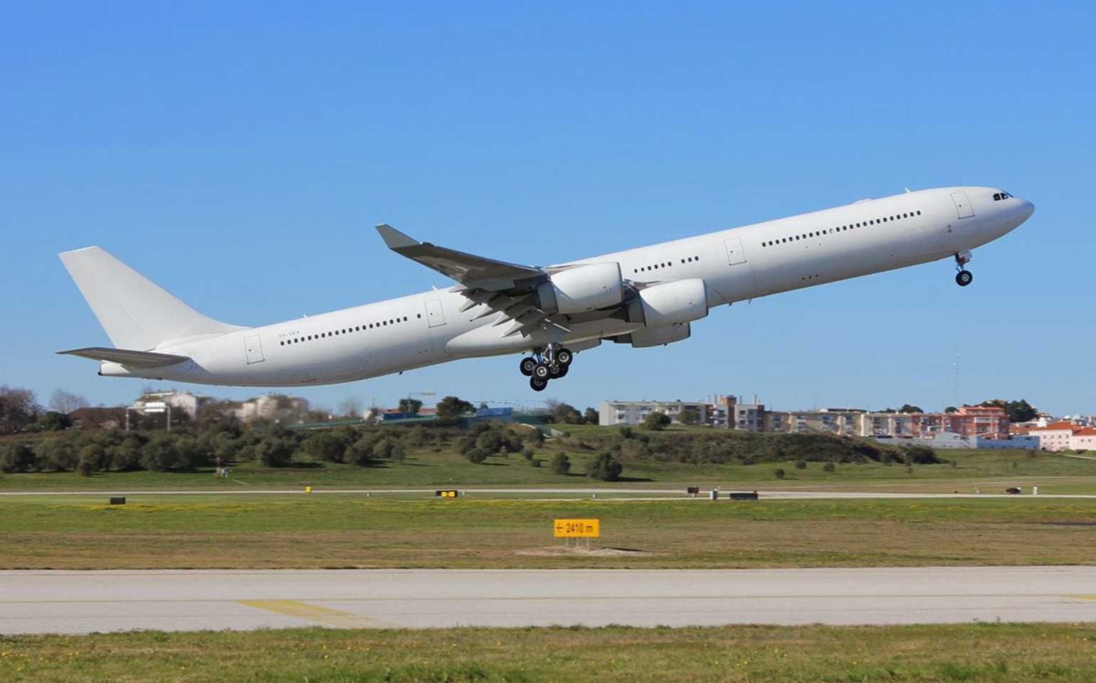 Airbus A340-600 large private aircraft charter flight taking off runway