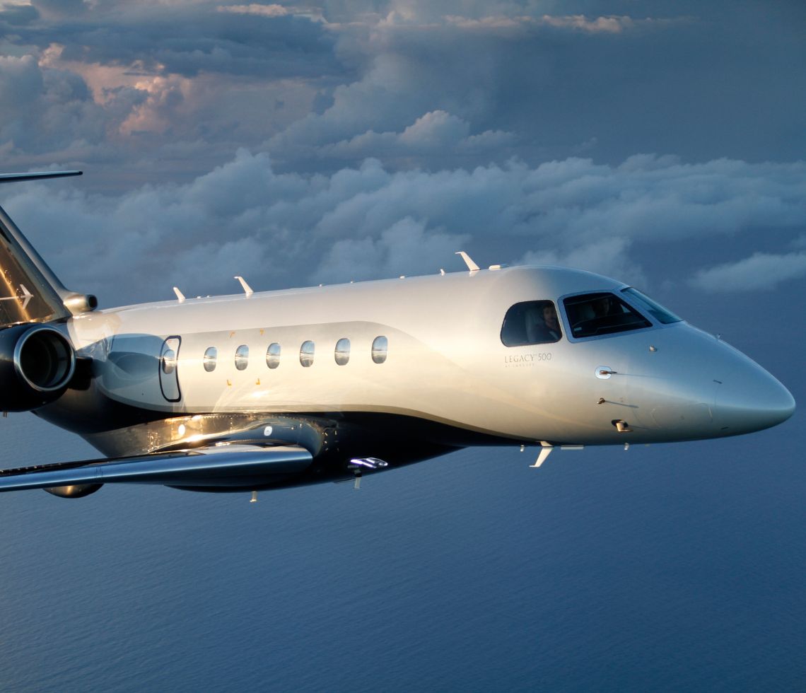 Embraer Legacy 500 private jet charter flying in sky
