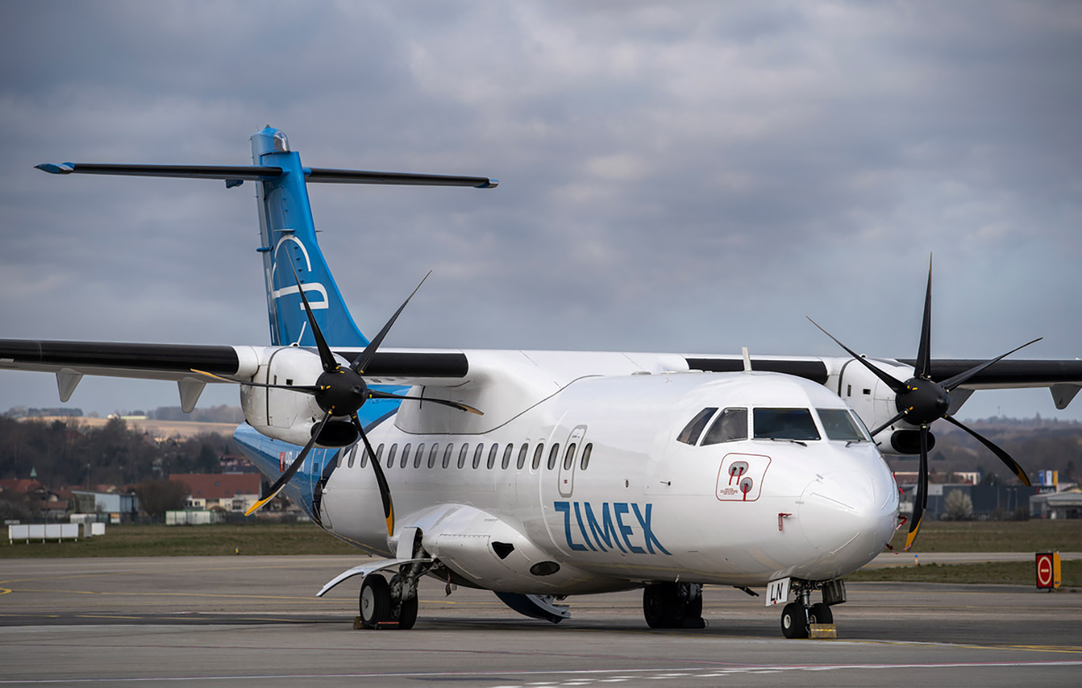 ATR 42 cargo charter aircraft on runway in day