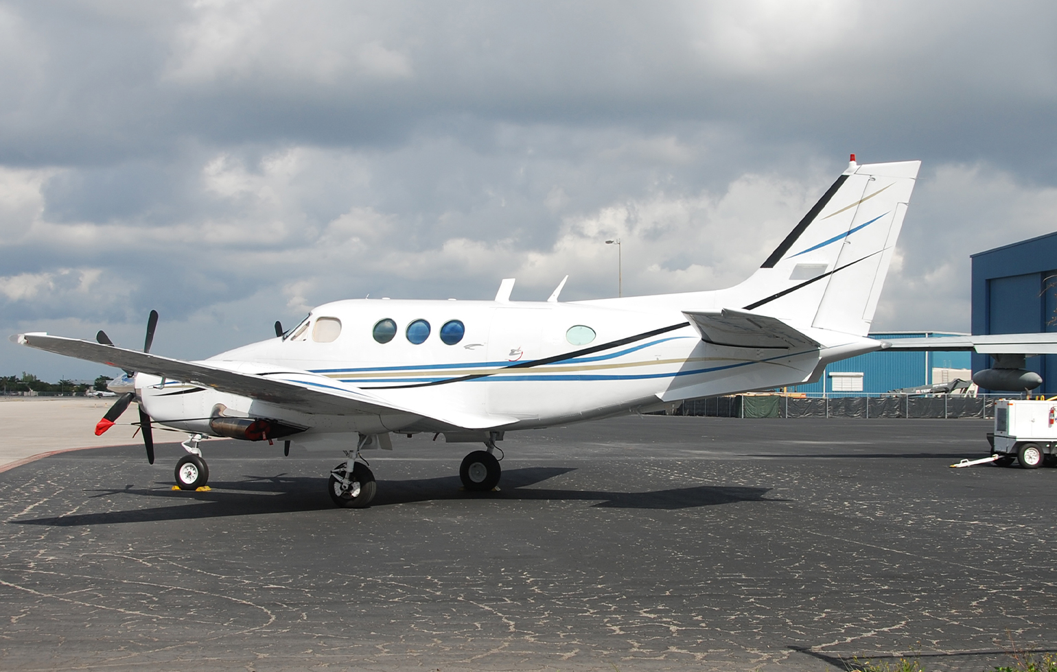 Beech King Air 90 cargo charter aircraft at airport parked